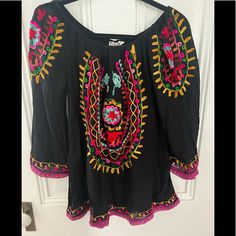 Boho And Be Admired As A Travelor Free People Esq Bright Embroidered Top Magenta Accented Lace At The Hem Black Embroidered Summer Blouse, Black Long Sleeve Top With Geometric Embroidery, Black Summer Blouse With Embroidered Sleeves, Embroidered Black Beach Blouse, Black Bohemian Top With Embroidered Sleeves, Bohemian Black Tops With Embroidered Neckline, Black Bohemian Blouse With Embroidered Sleeves, Embroidered Black Blouse For Beach, Traditional Black Embroidered Top For Spring