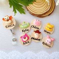 a bunch of personalized key chains with animals on them