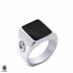 This extraordinary Onyx ring has initials on both sides of the ring. Let us know what initials you would like and we would be happy to make it for you. This masculine ring is sure to make your loved one happy, even if they are not accustomed to wearing jewelry. [MATERIALS] Center Stone: Onyx Carat : 2.0 Color: Black Cut: Rectangular Setting: Bezel Metal: 12.00 Grams of 14kt White Gold [ORDERS] All items that are made to order take about 7-12 days to create and to ship. [ADDITIONAL REQUESTS] If y Classic Black Initial Ring For Formal Occasions, Black Initial Ring With Polished Finish As Gift, Gift Black Initial Ring With Polished Finish, Classic Black Round Initial Ring, Luxury Black Engraved Ring With Polished Finish, Elegant Black Rings With Initials, Elegant Black Engraved Initial Ring, Elegant Engraved Black Initial Ring, Modern Black Engraved Rings