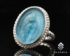 Pray For Us Two Tone Virgin Mary Cameo Ring 925 Silver Glass Intaglio Greek Coin Signet Ring Unique Dainty Ring Men's Ring Gift For Him ⭐3 YEAR GUARANTEE FOR ANTI-TARNISH⭐ 💍Item Details💍 SKU CODE: IMM23018LB ★ Material: 925 Sterling Silver (Rhodium Plated) ★ Silver Weight: App. 5.44 Grams {6 USA Size] ★ Ring Diameter: 2.3 mm ★ Ring Size: Available in variations  ★ Coin: Virgin Mary ★ Coin Size: 24,75X19 mm (With Border) ★ Coin Metarial: Green Glass  ★ Ring Plate: Available in variations to Ros Sterling Silver Signet Ring With Intaglio, Silver Intaglio Signet Ring For Wedding, Silver Signet Ring With Intaglio As Gift, Luxury Silver Rings With Intaglio, Silver Wedding Signet Ring With Intaglio, Formal Sterling Silver Engraved Ring With Intaglio, Formal Sterling Silver Intaglio Engraved Ring, Sterling Silver Intaglio Wedding Ring, Sterling Silver Intaglio Engraved Ring For Formal Occasions