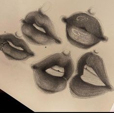 pencil drawings of different lips on paper