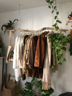 there are many clothes hanging on the rack