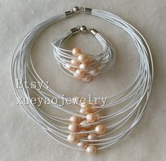 Welcome to my shop my dear friend. I hope you will like my jewelry, and most of my jewelry are made by myself. Please see the detail for this item: Pearl Jewelry: necklace Pearl Type: cultured fresh water pearl color: leather color offer white gray black; pearl color pink shape: rice size: around 10-12 mm length: around 17 - 20 inch， bracelet around 8 inch Metal: alloy, magnet clasp About shipping: I will send out your order in 1-3 business days from China. 1, To United States, will use US E-pac Handmade Gray Elegant Jewelry, Handmade Elegant Gray Jewelry, Elegant Handmade Gray Jewelry, Pink Rice, Tiny Pearl Necklace, Buy Pearls, Pearl Necklace Wedding, Bridesmaid Gifts Jewelry, Pearl Jewelry Necklace