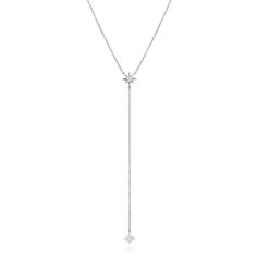 This lariat necklace is set in 14k gold and features 7 hand set diamonds. This necklace is on an 16-18" adjustable chain, with a 3" lariat dangle. White Gold Lariat Necklace With Adjustable Long Drop Chain, Luxury Sterling Silver Lariat Necklace, Sterling Silver Lariat Diamond Necklace With Adjustable Chain, White Gold Lariat Diamond Necklace, Silver Lariat Diamond Necklace, Luxury Long Drop Lariat Necklace In White Gold, Luxury White Gold Lariat Necklace With Long Drop, Luxury White Gold Long Drop Lariat Necklace, Starburst Minis