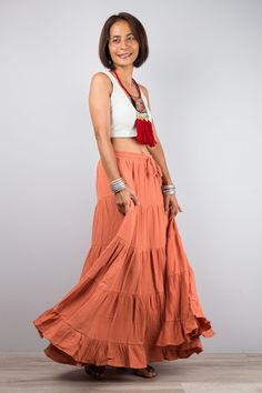 "Orange skirt, Women's Tiered peasant maxi skirt,  Long orange boho skirt, Mamma mia skirt, double cotton gauze skirt, flare skirt, skirt with pocket, skirt for women, sleeveless dress, donna sheridan skirt, terracotta skirt Elastic waistband and a drawstring for a perfect fit. PRODUCT SIZE : One Size Fits Most * Waist : max up to 44\" * Hips : up to 54\"  * Length : 38\" from waist to hem NOTE :  * Model chest : 32\", waist : 24\" hips : 35\"  * Combined Height is 5\"6 > I'm 5\"2 (158cm) and I' Peasant Style Tiered Beach Maxi Skirt, Beach Tiered Peasant Maxi Skirt, Beach-style Gathered Maxi Skirt, Beach Maxi Skirt With Gathered Detail, Flowy Hippie Maxi Skirt, Peasant Style Flowy Maxi Skirt For Beach, Peasant Style Ruffled Maxi Skirt For Summer, Bohemian Cotton Maxi Dress With Flowy Skirt, Bohemian Flowy Lined Maxi Skirt