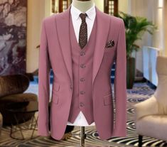 "This is a Classic 3 Piece Suit by Golden Attire crafted from high quality fabric and imported materials. Our products are handcrafted by experienced tailors who make sure the that the stitching is precise, lining is proper and the overall product is sturdy enough to not go out of shape for more than a few years. Also all our products have extra margins in their length, sleeves, sides so it's easily alterable if your size changes after some time. To see more available colours and designs in this collection, Check out the 'Classic Two Piece Suits' Section. *This is a 3 piece set of a jacket and a trouser. *We also offer customization so we can provide you an even better fit if you massage us your measurements (in inches) of Chest, Stomach, Waist, Hip, Shoulder and Actual Height after orderi Fitted Pink Tuxedo For Groom, Pink Fitted Tuxedo For Groom, Pink Three-piece Suit With Notch Lapel For Wedding, Elegant Pink Groom's Suit, Elegant Pink Blazer For Groom, Tailored Pink Tuxedo For Business, Pink Tailored Three-piece Suit For Wedding, Tailored Pink Three-piece Suit For Semi-formal Occasions, Pink Three-piece Suit With Suit Collar For Formal Occasions