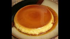 a pancake covered in caramel sauce on a plate