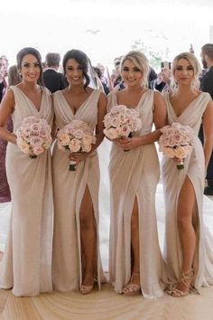 the bridesmaids are all wearing different dresses