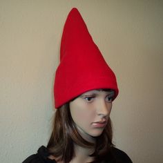 a female mannequin head wearing a red hat