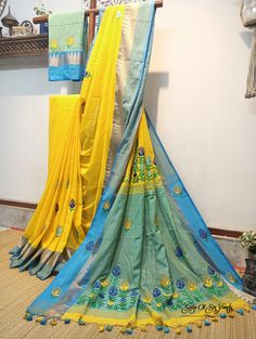 Elevate your ethnic wardrobe with our stunning handloom pure cotton saree in vibrant yellow, adorned with a magnificent firoza-colored temple woven border. This saree is a masterpiece of craftsmanship, featuring intricately embroidered multicolor floral design, neatly and artistically crafted onto the fabric. In addition to its exquisite design, this saree is designed for comfort and style. Crafted from pure, soft cotton, it offers a luxurious and comfortable drape, making it a joy to wear on any occasion. To complete the ensemble, a matching blouse piece with delicate embroidery work is included. Discover the perfect blend of tradition, artistry, and comfort with this exceptional pure cotton saree. Elevate your fashion quotient while celebrating the rich heritage of Indian textiles. Shop Yellow Chanderi Dupatta With Embroidered Border, Yellow Embroidered Mulmul Traditional Wear, Diwali Yellow Embroidered Saree, Semi-stitched Cotton Embroidered Saree Fabric, Semi-stitched Multicolor Embroidered Cotton Saree, Embroidered Cotton Saree For Festive Season, Festive Cotton Saree With Embroidered Border, Festive Cotton Embroidered Saree, Festive Embroidered Cotton Saree