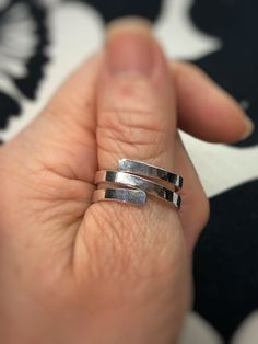 "This ring is made with a thick gauge Fine Silver wire that has been hammered and shaped into a stylish, modern design perfect for everyday wear! Fine Silver is 99.9% pure silver vs. Sterling Silver which is 92.5% pure silver and 7.5% copper. Fine silver will not tarnish as quickly as sterling but to keep it's shine, a jewelry polishing cloth is all that's needed.  ❤️ MATERIALS USED      ▪️Fine Silver wire ❤️ MEASUREMENTS      ▪️The back of the ring is approximately 5/16\" wide and the front is 3/8\" ❤️ SIZE      ▪️Ring size 9 ❤️ PROCESSING TIME      ▪️The item will be processed and shipped within 1-3 business days from the                   time the order is placed and payment is received. ❤️ SHIPPING/PACKAGING      ▪️This item will be shipped USPS first class to the USA.       ▪️If you w Hammered Open Ring For Promise, Modern Adjustable Stackable Rings For Anniversary, Modern Adjustable Hypoallergenic Stackable Rings, Adjustable Hammered Jewelry For Promise, Hammered Thick Band Ring As Gift, Hand Forged Open Band Ring For Gift, Hand Forged Open Band Ring As Gift, Hand Forged Modern Rings As Gifts, Modern Hand Forged Rings As A Gift