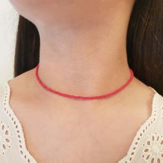 Red choker necklace Red beaded choker Dainty necklace Glass choker Beaded necklace Beach choker collar Boho choker necklace The red colored glass choker is 13 inches and can be adjusted up to 15 inches with a 2 inches extender chain. Made from 2mm tiny glass seed beads. This necklace has a dainty look and is crafted sturdy enough to wear every day. Every piece is made to order with care and love. ✓ HOW TO ORDER: ♥ Choose the color of your choice ♥ Choose the size of your choice ♥ If you would li Trendy Red Choker As Gift, Trendy Red Necklaces With Round Beads, Trendy Red Round Bead Necklaces, Trendy Red Round Beads Necklace, Trendy Red Necklace With Colorful Beads, Trendy Red Beads For Gifts, Trendy Red Necklace For Festivals, Trendy Red Beaded Necklaces, Trendy Red Necklaces With Colorful Beads