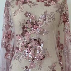 a dress with sequins and flowers on it