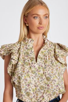 A wear-everyday hero, the Margarita Poplin Top features ruffled mandarin collar with split v-neck and double layer ruffle sleeves that adds soft romance to this versatile top. Throw it on over our Dolan D-Ring Pant or your favorite jeans, skirts, shorts—you name it. K4ETW2627C-ANP Casual Ruffled Split Neck Blouse, Chic Ruffled Split Neck Blouse, Chic Split Neck Blouse With Ruffles, Natural Print, Everyday Heroes, Poplin Top, Blazer Vest, Ruffle Sleeves, Mandarin Collar