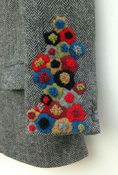 a close up of a piece of clothing with flowers on it