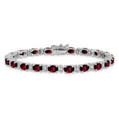 Rhodium over 14k white gold 12 cttw oval garnet and 0.1 cttw diamond bracelet. Measures approximately 3/16 of an inch in width and has a box catch closure. Garnet Birthstone, Dainty Bracelet, White Gold Bracelet, Wedding Jewelry Bracelets, Red Gemstones, Diamond Chain, Birthstone Bracelets, Garnet Stone, Fine Jewelry Bracelets