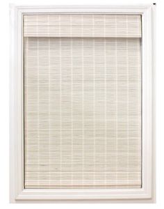 a window with a white roller shade on the top and bottom panel, in front of a