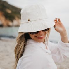 Clearwater Bucket Hat-Hat-Pretty Simple Wholesale Chic Everyday Boater Hat For Spring, Chic Short Brim Sun Hat For Everyday, Chic Everyday Sun Hat With Short Brim, Chic Natural Color Bucket Hat, Chic Natural Bucket Hat, Summer Bucket Hat With Flat Brim For Everyday, White Woven Sun Hat With Curved Brim, White Beachy Sun Hat One Size Fits Most, Chic Cream Boater Hat For Beach