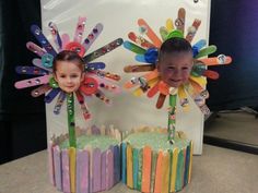 two children's birthday cakes made out of popsicle sticks