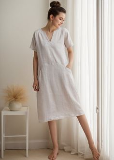 Wearing this simple shift dress let you move freely, keep fresh in hot weather, both suit home or going out. ★★FEATURES 100% Linen Two side pockets V neck dress Short sleeve Shift dress Casual dress Mama dress Simple dress Perfect for Summer, Spring ★★ Model Size Height approx 162 cm (5′ 4″)  Bust 84 cm (33")  Waist 66 cm (26")  She wears size XS. ★★ Bespoke Order Service If you Request other color Request the length Your height is not between 155 cm- 172 cm Your weight is over 75 kg I can do it White Casual Dress With Split Neck, White Split Neck Casual Dress, Relaxed Short Sleeve Summer Dresses, Casual Shift Midi Dress With Split Neck, Casual Linen V-neck Shift Dress, Relaxed Cotton Dress For Home, Casual V-neck Shift Linen Dress, Relaxed Fit Cotton Dress For Home, Casual Knee-length Shift Linen Dress