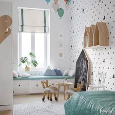 a child's bedroom decorated in white and blue