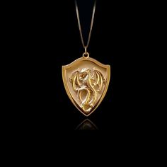 Unleash your inner fire with our Dragon pendant. Crafted with exquisite detail, this powerful piece embodies the untamed strength and mystique of the dragon, a symbol of wisdom and fierce protection. Feel the energy of this ancient guardian as it wraps you in its embrace, reminding you of your own unyielding spirit and the burning passion within. PENDANT INFORMATION This pendant is made of real, solid gold.• Made in USA• Material: 14k or 18k solid gold• Finish: polished• Height: 1.2" (30,5 mm) x Spiritual Gold Jewelry With Dragon Design, Symbolic Gold Dragon Jewelry, Symbolic Gold Jewelry With Dragon Design, Gold Fantasy Style Necklace For Fantasy Events, Yellow Gold Dragon Pendant Jewelry, Yellow Gold Dragon Design Pendant Jewelry, Warrior Style Gold Necklaces As Gift, Gold Dragon Design Round Pendant Jewelry, Gold Fantasy Jewelry With Dragon Design