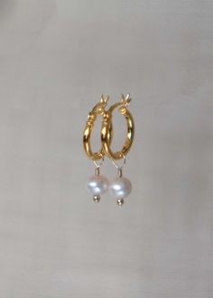 Our Pearl Hoop Gold Earrings in 18k gold vermeil are an all time classic hoops that pairs well with every outfit and suits everyone. Sold as a pair. DETAILS * Dimension - Gold Hoops - 13mm, total length - 25mm * Materials - 18k gold thick gold vermeil over 925 sterling silver (nickel free, hypoallergenic), genuine freshwater round pearl * Handmade in our sunny Houston jewelry studio SHIPPING * At checkout, you also have the option to choose faster shipping on the drop-down menu. We highly recomm Hoop Gold Earrings, Pearl Hoop Earrings, Jewelry Studio, Gold Hoops, Gifts For Girls, Gold Vermeil, Gold Earrings, For Girls, Houston