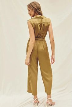 Magnify your style in this supremely chic satin jumpsuit! This gorgeous piece features a surplice neckline, shoulder ruching, and a sash with loops for the perfect belt. With relaxed straight legs, side pockets, and an elastic waist, you will look stunning and feel comfortable all at once. Crafted from 100% polyester, this jumpsuit looks amazing with heels and is sure to turn heads! Satin Jumpsuit, Surplice Neckline, Sleeveless Shirt, Elastic Waist, Straight Leg, Jumpsuit, Satin, Turn Ons, Elastic