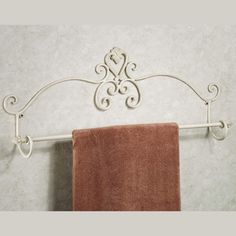 a towel rack with two towels hanging from it's sides and an orange towel on the other side