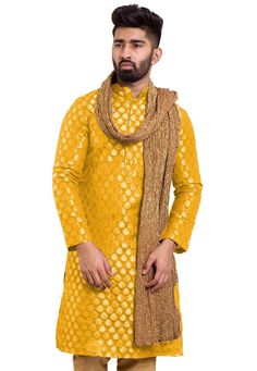 Art Chanderi Silk Jacquard Kurta in Mustard. This Readymade attire with Cotton Lining is Woven in Ornamental Motifs and is Crafted in Chinese Collar Neck and Full Sleeve. Available with a Matching Mask.Do note: Stole, Bottom and Footwear shown in the image is for presentation purposes only. Half to one inch may vary in measurement. (Slight variation in actual color vs. image is possible). We sell all kinds of menswear. Mens Kurta | Mens Kurta Pajama | Mens Sherwani | Mens Sherwani Sets | Traditi Yellow Brocade Traditional Wear For Festive Occasions, Gold Embroidered Brocade Kurta, Embroidered Brocade Gold Kurta, Embroidered Gold Brocade Kurta, Gold Kurta With Zari Weaving In Traditional Drape, Gold Kurta With Self Design, Festive Gold Kurta With Zari Weaving, Festive Jacquard Set With Dupatta, Festive Jacquard Sets With Dupatta