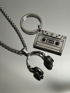 "The ultimate present for him: A sleek Stainless Steel Vintage Cassette Keychain. Headphone pendant option available.  Functional, Fashionable & Durable Men's Stainless Steel. Stainless Steel Vintage Cassette Keychain - Perfect Gift for the DJ, Musician, or Music Lover in your life. Amazing detail. Length 1.5\" Width 3/4\" Whether you are buying for yourself or the man/woman in your life, this is going to be the piece that you/he/she will love for years to come!  K E E P * I N * T O U CH https:/ Dj Gifts For Men, Guy Keychain Ideas, Is This Love, Gifts For Musicians Boyfriend, Cool Key Chains, Masc Jewelry, Skateboard Jewelry, Musical Earrings, Cool Stuff For Men