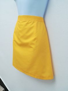 "NOELLE SKIRT Handmade skirt 65% Polyester 35% cotton Color: yellow This skirt is also available custom made! We need to know: waist, hips, length Sizes XS: CHEST 84 CM / WAIST 66 CM / HIPS 90 CM S: CHEST 88 CM / WAIST 70 CM / HIPS 94 CM M: CHEST 92 CM / WAIST 74 CM / HIPS 98 CM L: CHEST 96 CM / WAIST 78 CM / HIPS 102 CM XL: CHEST 100 CM / WAIST 82 CM / HIPS 106 CM XXL: CHEST 104 CM / WAIST 86 CM / HIPS 110 CM *Notice that the pictures are made by professionals and prepare for the best look on t Fitted Retro Style Mini Skirt, Retro Fitted Skort With Lined Skirt, Retro Fitted Lined Skirt, Retro Fitted Mini Skirt With Lining, Retro Fitted Short Skirt, Retro Mini Length Skort, Retro Cotton Mini Skort, Fitted Retro Cotton Mini Skirt, Retro Fitted Cotton Skort