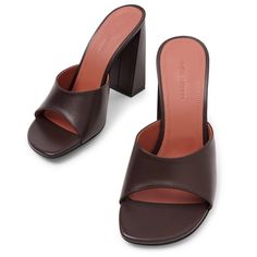 Brown leather mules from Amina Muaddi. The Brigitte mules are made of brown leather with a peep toe, set on a 95mm slanted block heel.Leather soleTrue to sizeMade in Italy Amina Muaddi, Leather Mules, Block Heels, Brown Leather, In Italy, Italy, Leather