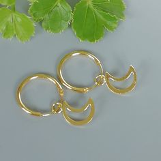 A PAIR of 12 mm sterling silver hoops. Comes with a delicate crescent moon charm. Charm can be used with a neck chain anklet or bracelet. Dimensions: Hoops: 12 x 1 mm Crescent: 22 x 3.5 mm Drop length 15 mm These earrings are made of 925 hypoallergenic sterling silver dipped in gold. Price listed is for ONE PAIR Can be packaged in a gift box. I can include a personal message from you if needed You are welcome to contact me at... bhavnakwintra1956@gmail.com For more beautiful pieces from my shop, Hoops Silver, Hoop Charms, Neck Chain, Moon Charm, Bohemian Earrings, Chain Anklet, Gold Price, Sterling Silver Hoops, Gold Hoops