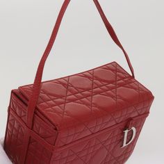 Brand: Dior Model: Cannage Lady Color: Red Material: Leather Inclusions: / Dimensions: W16cm x H11cm x D8cm Serial number: CM0077 Country of origin: Spain Condition: AB - good condition. The Christian Dior Cannage cosmetic case, made in Spain, is a luxury accessory designed for the modern woman. Emblazoned with the brand's iconic cannage motif, this bag is crafted in high-quality red leather, adding a touch of sophistication to your beauty routine. The exterior of this item shows no noticeable d Red Shoulder Bag With Original Box For Daily Use, Red Shoulder Bag For Daily Use With Original Box, Designer Red Rectangular Case Bag, Red Formal Shoulder Bag Rectangular Case, Red Bag For Everyday Use, Designer Red Shoulder Bag As Gift, Red Evening Shoulder Bag, Classic Red Bag For Gift, Classic Red Shoulder Bag For Gift