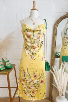 Get ready for wedding season in the Lulus Sunny Blossom Yellow Satin Floral Print Cowl Neck Midi Dress! Textured woven satin, with a vibrant floral pattern throughout, shapes this sweet dress with a cowl neckline, a fitted bodice, and adjustable spaghetti straps. Fitted waist features light ruching at one side before it carries into a wrapping midi skirt. Midi Dress Satin, Happy Hour Outfit, Cowl Neck Midi Dress, Festive Outfits, Spring Wedding Guest, Spring Wedding Guest Dress, Yellow Satin, Lulu Fashion, Wedding Guest Looks