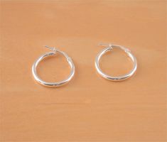 Sterling silver, plain hoop earrings. Size 18.5mm. Both earrings are stamped 925.    These earrings will be gift wrapped in acid free tissue paper and pretty organzo gift bag.      UK standard delivery can take between 1-2 working days.      U.SA & Europe standard delivery can take 10-28 working ... Silver Celtic Rings, Snowflake Jewelry, Celtic Earrings, Real Gold Jewelry, Earrings Hoop, Pin Jewelry, 925 Silver Jewelry, Style Earrings, Silver Hoops