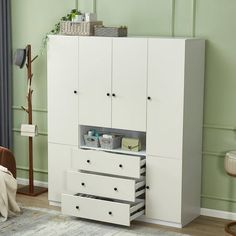 a white cabinet with drawers in a room