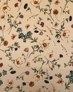 an old wallpaper with flowers and leaves on it's side, as seen from above