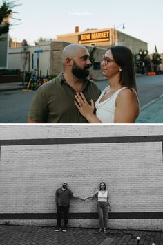 two people standing next to each other in front of a brick wall and holding hands