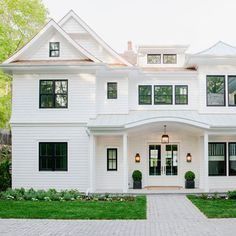 a large white house with two story windows