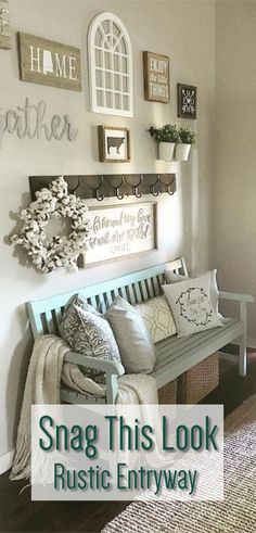 a white bench sitting in the middle of a living room next to a wall with pictures on it