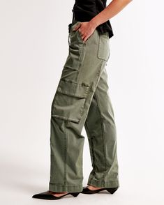 Elevate your casual wardrobe with the Abercrombie & Fitch Women's Baggy Cargo Pull-On Pant in a chic Olive shade. These versatile pants are designed to be worn high, mid, or low rise, adapting effortlessly to your style and comfort preferences.

- Size: XXS SHORT
- Color: Olive
- Material: Body - Cotton, Elastane; Pocket Bag - Cotton
- Gender: Female
- Style: Wide Leg Pants
- Features: High-rise with adjustable rise options, drapey twill fabric, all-over garment dye wash, baggy silhouette, cargo Trendy Elevated Casual Cargo Jeans With Pockets, Relaxed Fit Wide-leg Utility Cargo Pants, Mid-rise Relaxed Fit Cargo Pants For Fall, Fall Mid-rise Relaxed Fit Cargo Pants, Trendy Relaxed Fit Mid-rise Cargo Pants, Trendy Bottoms With Pockets For Elevated Casual Look, Relaxed Fit Cargo Style Straight Leg Bottoms, Fall Utility Mid-rise Cargo Pants, High Rise Utility Cargo Shorts For Spring