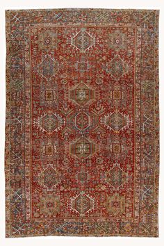 an antique persian rug with red and gold colors