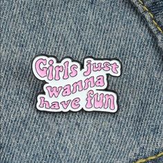 a pink sticker that says girls just wanna have fun on the back of a jean jacket