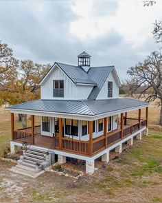 a large white house with a metal roof