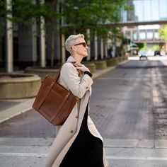 Finally - a show-stopping leather tote that can accommodate your needs (and your hats!) The Natalie's diverse functions keep your hat, blanket, or travel pillow secure and accessible! A large exterior pocket is perfect for your phone or reading material, while the raw leather interior is spacious enough for your weekend getaway supplies or everyday essentials. The bottom two snaps on the leather straps allow for wider-brimmed hats (image shown with 13.5" hat) and the detachable crossbody strap g Paper Grocery Bags, Raw Leather, Reading Material, Wide Brimmed Hats, Weekend Getaway, Everyday Essentials, Wide Brimmed, Leather Interior, Grocery Bag