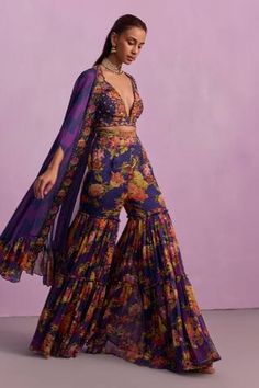 Purple cape with printed floral motif frill border, embellished by beads and crystals. Comes with inner padded bustier and tiered gharara. - Aza Fashions Purple Gharara, Purple Cape, Cape Set, Blouse Back, Purple Blouse, Stunning Outfits, Bright Purple, Floral Ruffle, Floral Motifs