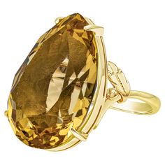 This color-rich cocktail ring features a pear shape golden citrine weighing 30.92 carats total, beautifully set in a four prong basket setting. Finely made in 18k yellow gold. Basket Setting, Gold For Sale, Cocktail Ring, Pear Shape, Yellow Gold Rings, Cocktail Rings, Pear Shaped, Citrine, Fashion Rings