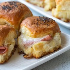 ham and cheese sliders on a white plate